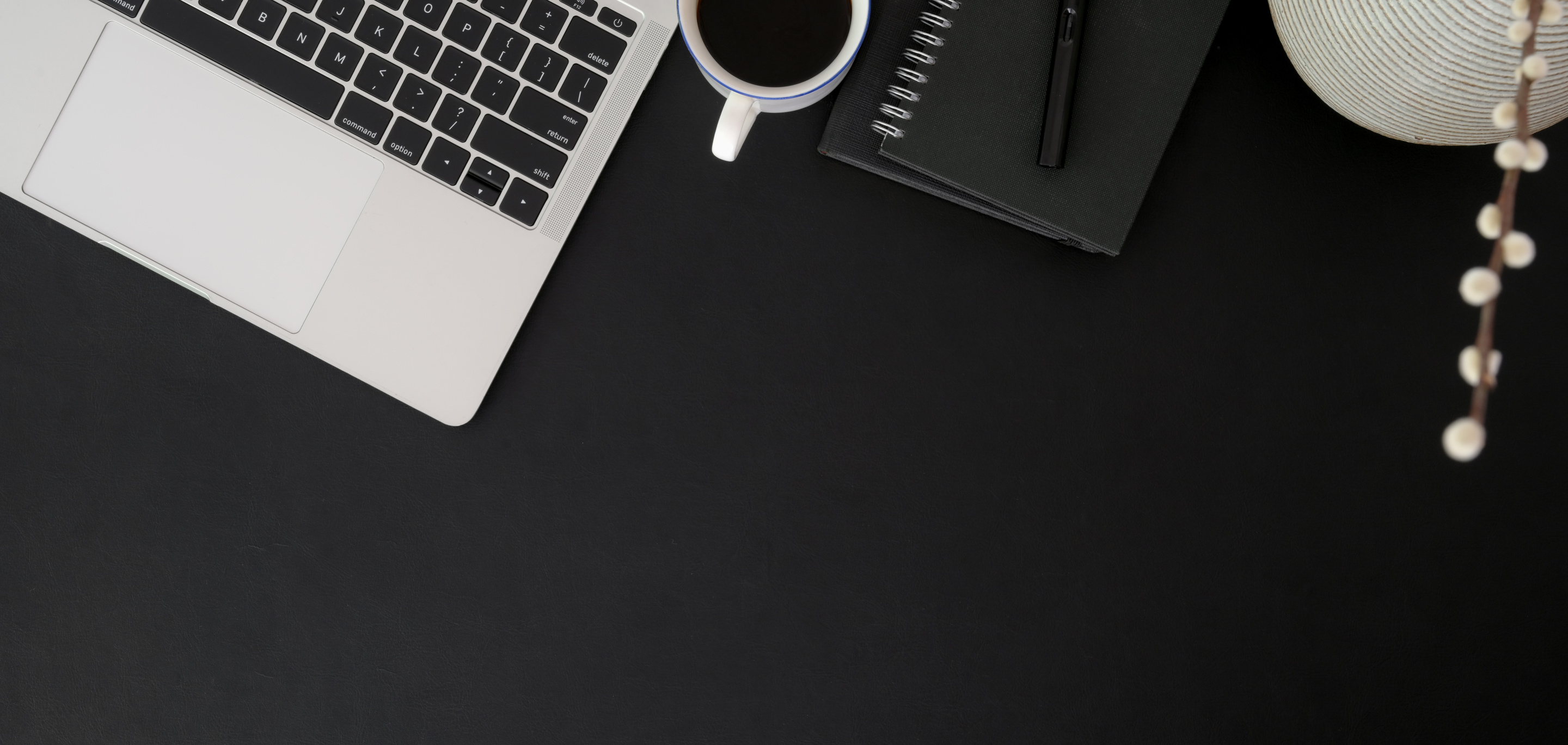 Black Pen Beside Macbook Pro